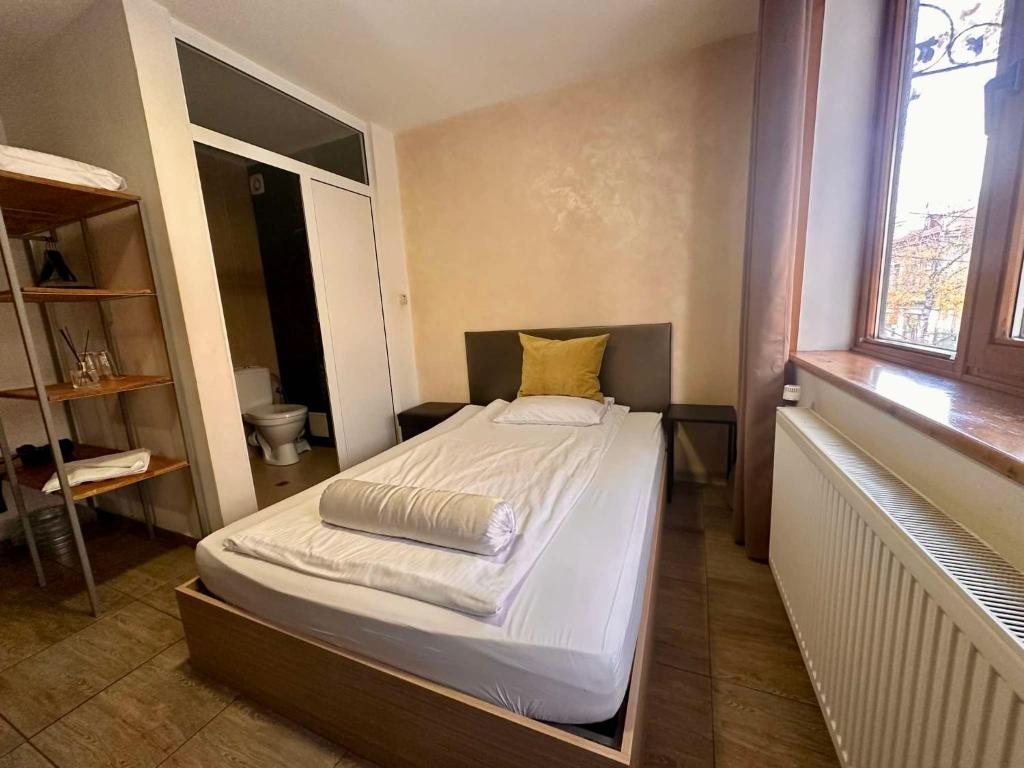 Postel nebo postele na pokoji v ubytování Family Hotel Amor