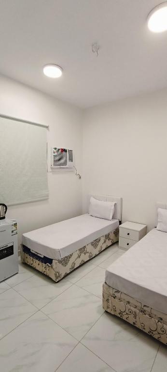 Postel nebo postele na pokoji v ubytování عمارة دانة بنت أحمد Dana Bint Ahmed