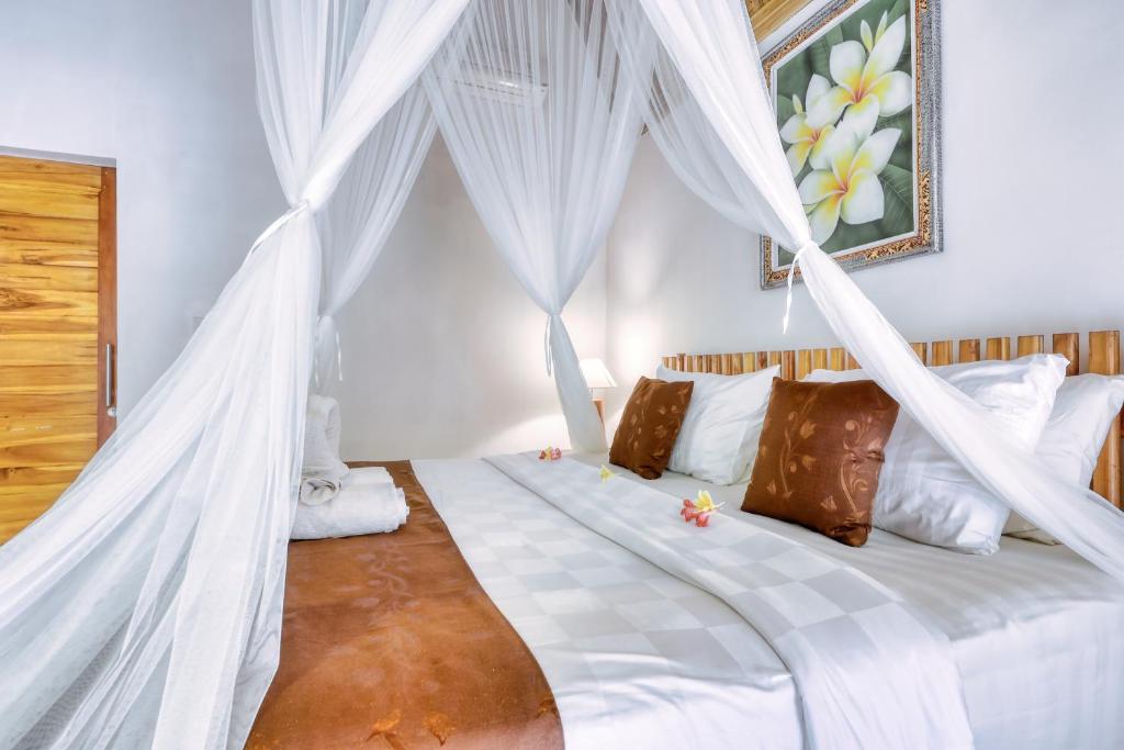 En eller flere senge i et værelse på Komurd Lavender Bungalow