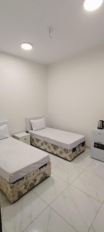 Postel nebo postele na pokoji v ubytování عمارة دانة بنت أحمد Dana Bint Ahmed
