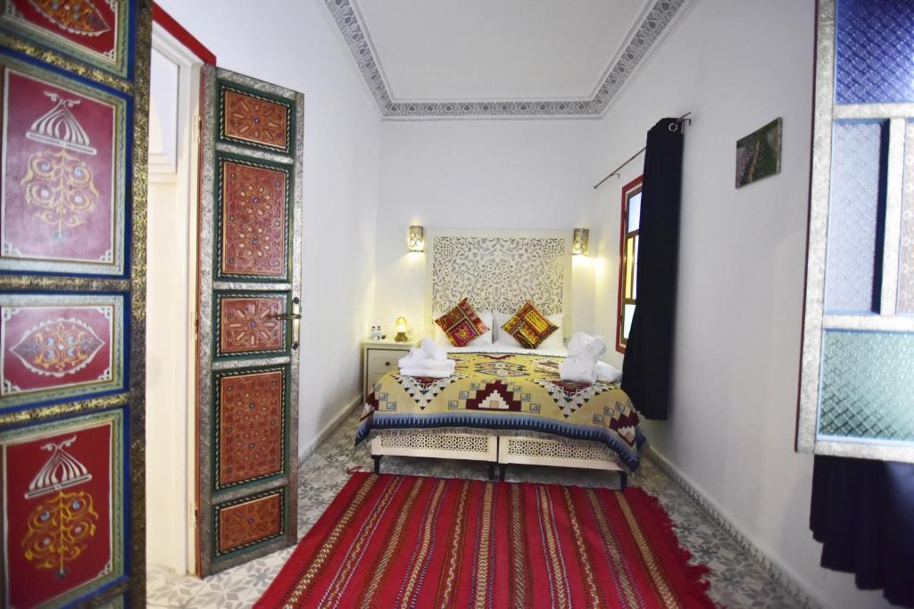 Ein Bett oder Betten in einem Zimmer der Unterkunft Zoco Riad
