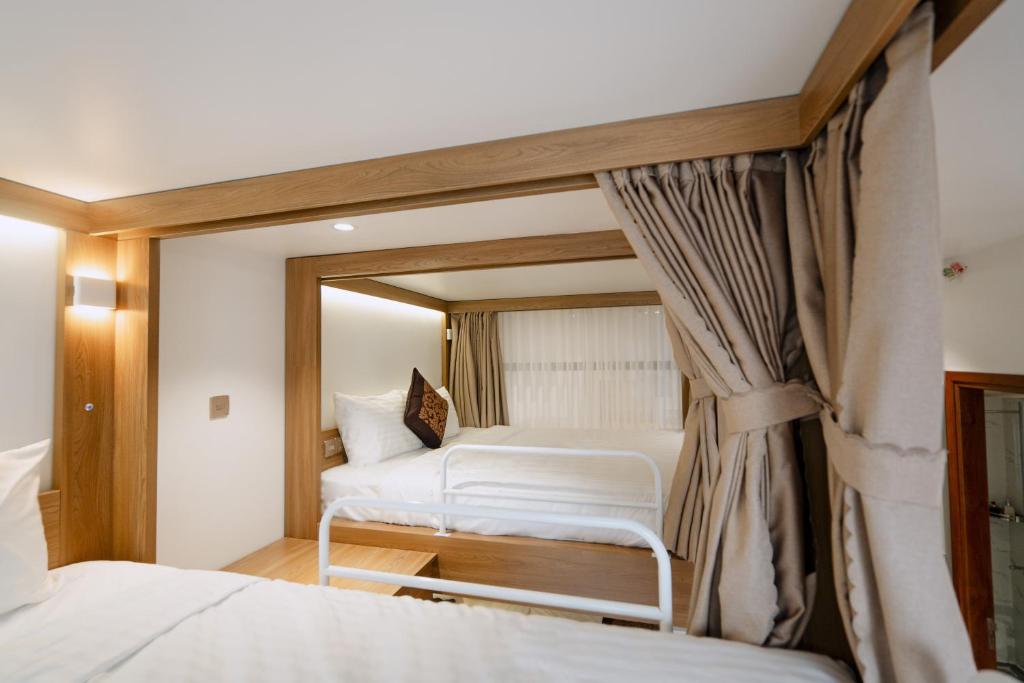 Postel nebo postele na pokoji v ubytování L'Universo Premium Apartment