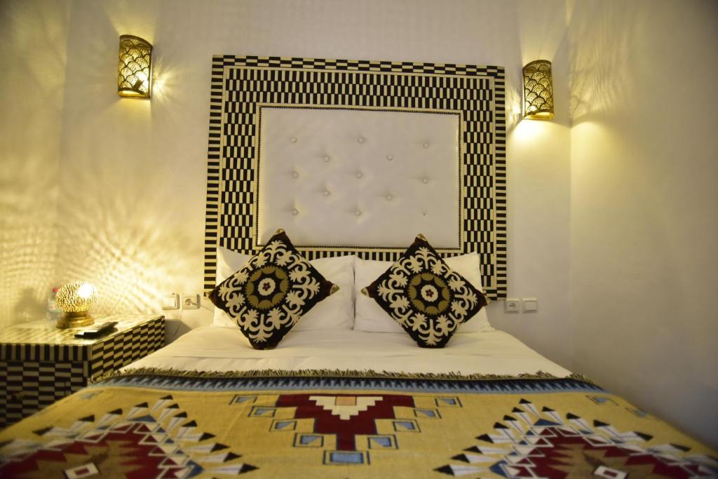 Ein Bett oder Betten in einem Zimmer der Unterkunft Zoco Riad