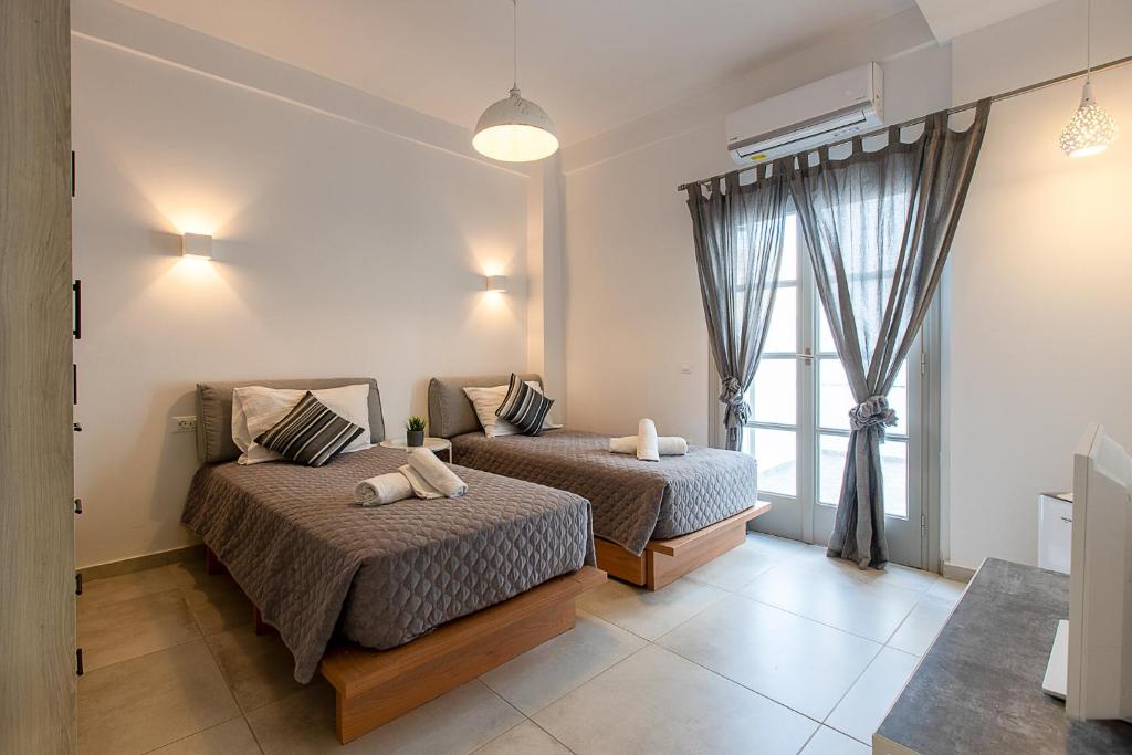 Postel nebo postele na pokoji v ubytování Santorini Garden Homes
