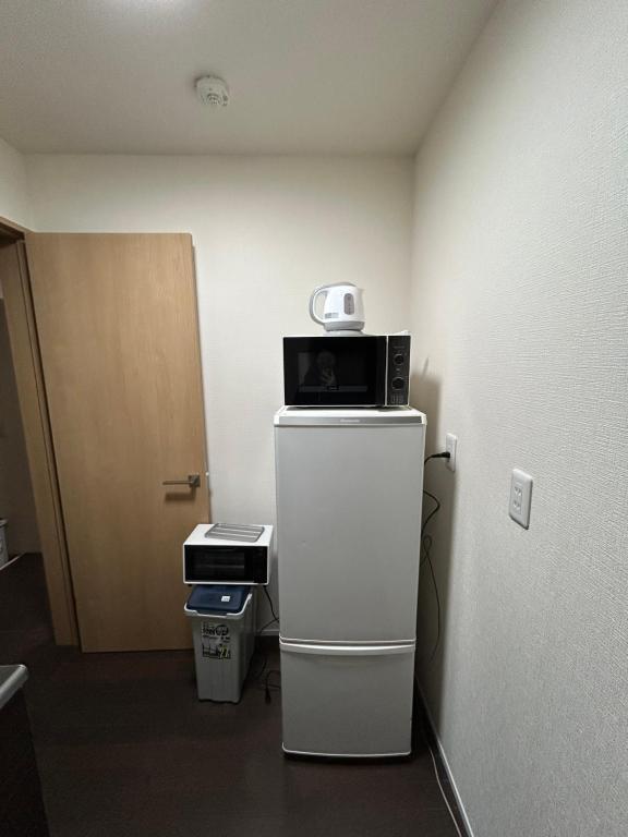 Kuchyň nebo kuchyňský kout v ubytování 高島市一棟貸切可能貸別荘グループファミリーok 大人数でご利用だとお得連泊がお得BBQ可能自転車無料利用可ペット可 駅徒歩10分