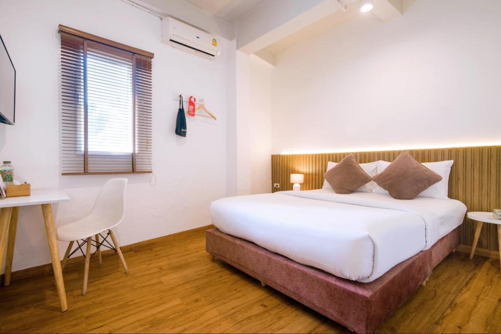 Postel nebo postele na pokoji v ubytování Hotel PAPA Bangkok Siriraj