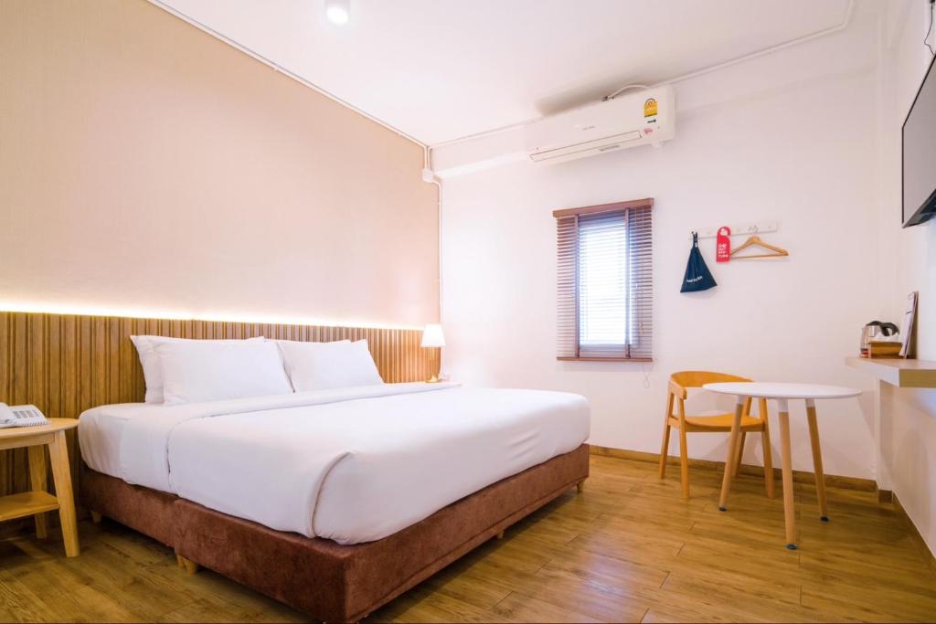 Postel nebo postele na pokoji v ubytování Hotel PAPA Bangkok Siriraj