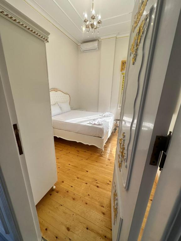 Postel nebo postele na pokoji v ubytování Atum