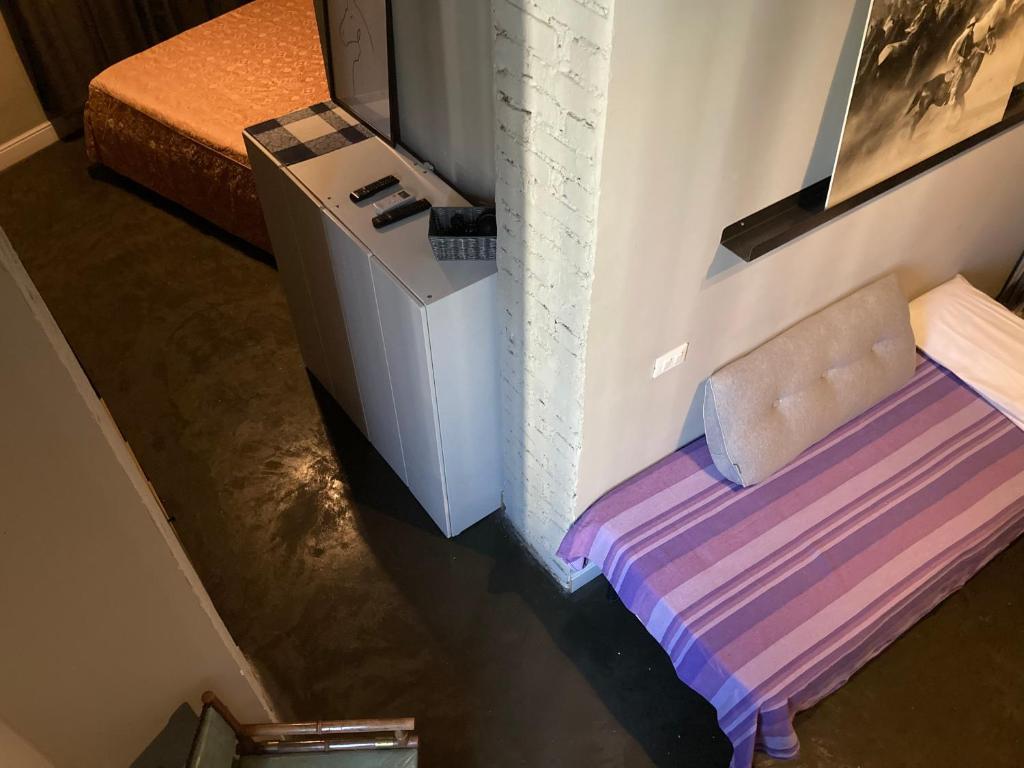 A bed or beds in a room at Hotel Calypso