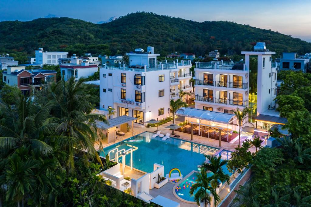 an aerial view of a resort with a swimming pool at Sanya Haishi Swimming Pool Design Hotel in Sanya