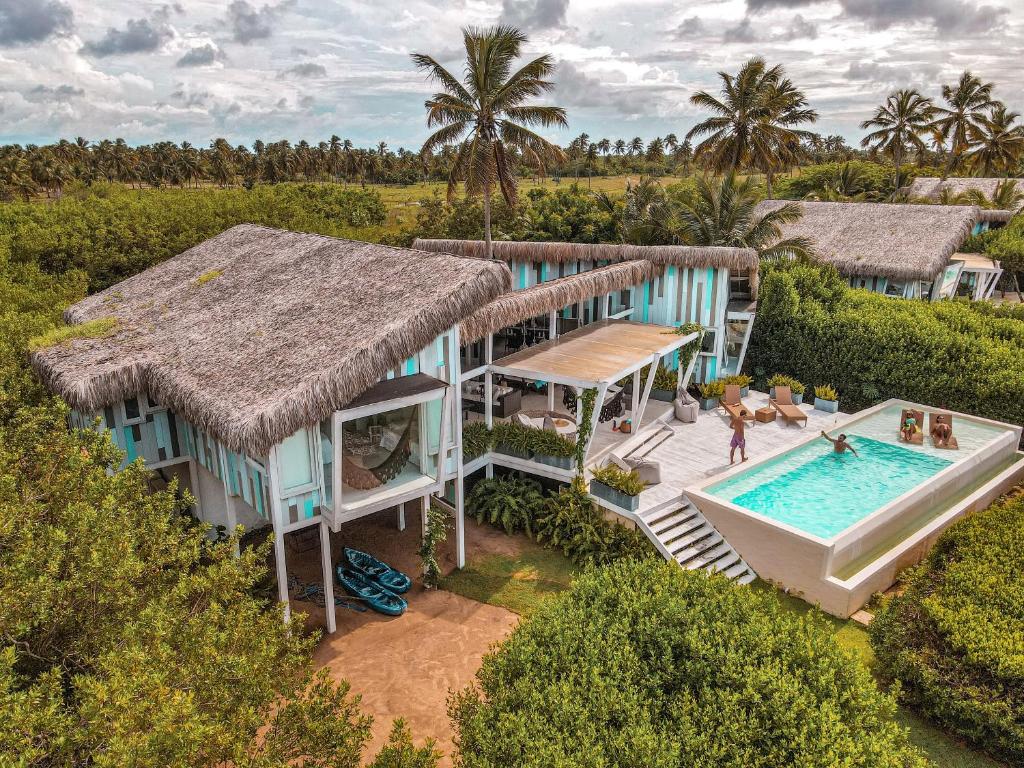 an aerial view of a house with a swimming pool at Beach Houses Moitas in Amontada