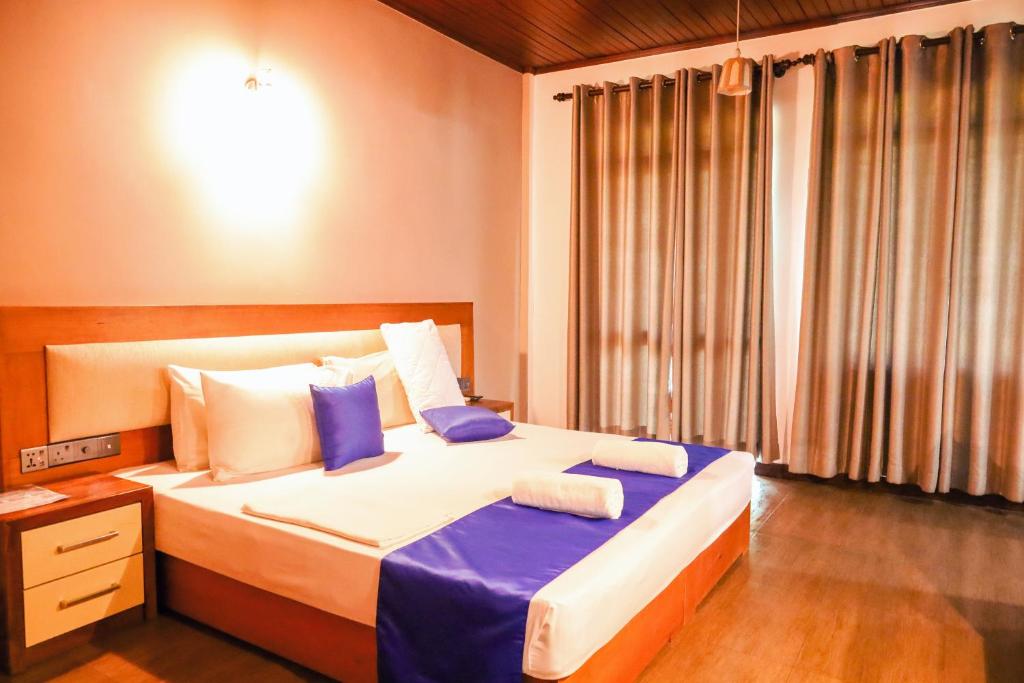 Postel nebo postele na pokoji v ubytování Hotel Elephant Bay