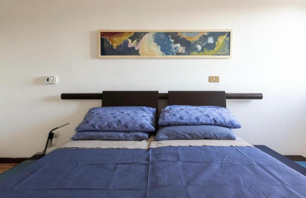 Postel nebo postele na pokoji v ubytování Salesiani Room A