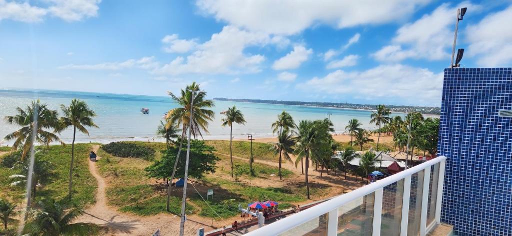 a view of the beach from the balcony of a resort at Apartamento Tambau a Beira Mar in João Pessoa