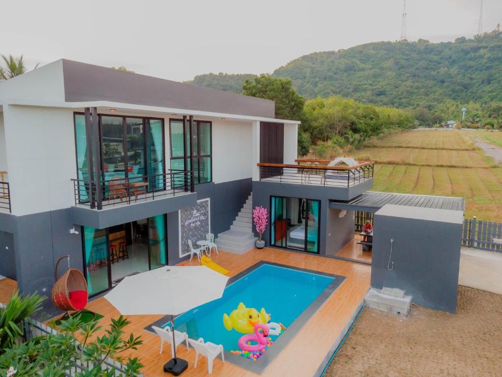 an aerial view of a house with a swimming pool at Mountain & Sea Pool Villa ทับสะแก in Prachuap Khiri Khan