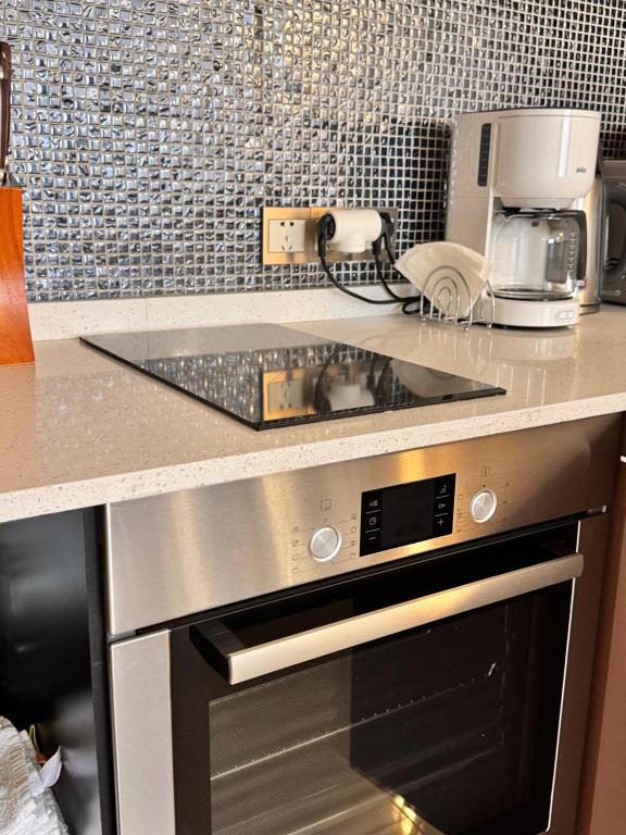 Kuchyň nebo kuchyňský kout v ubytování Happy Holidays Apartments in New Gudauri