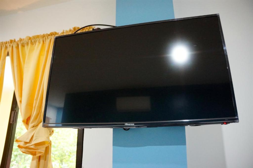 TV a/nebo společenská místnost v ubytování Mayas Guesthouse