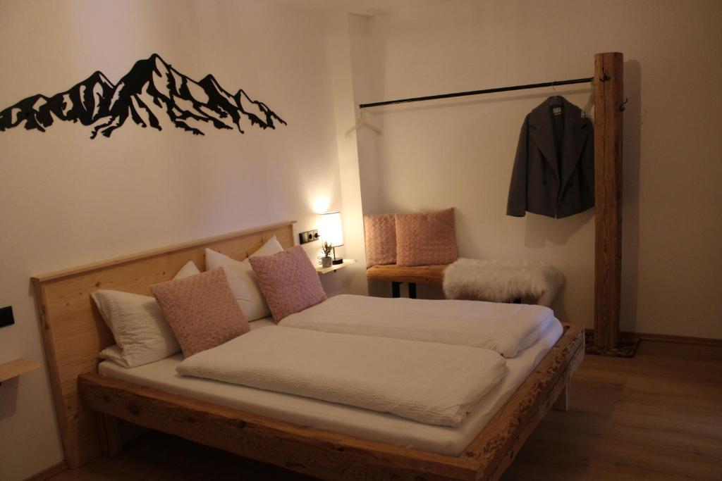 Postel nebo postele na pokoji v ubytování Ferienwohnung Enzian