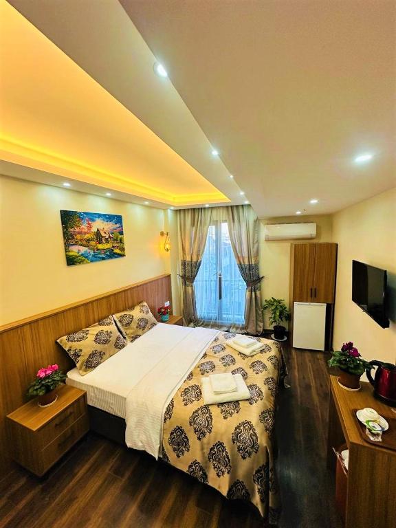 Postel nebo postele na pokoji v ubytování Hotel By Historia