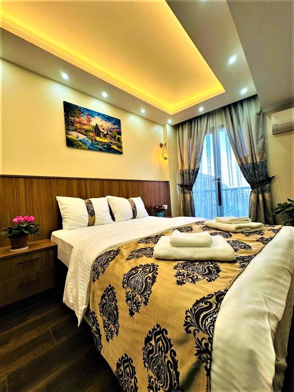 Postel nebo postele na pokoji v ubytování Hotel By Historia
