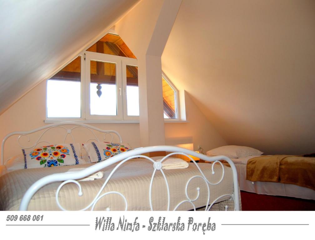 Posteľ alebo postele v izbe v ubytovaní Willa Nimfa pokoje i apartamenty, również cała willa na wyłączność