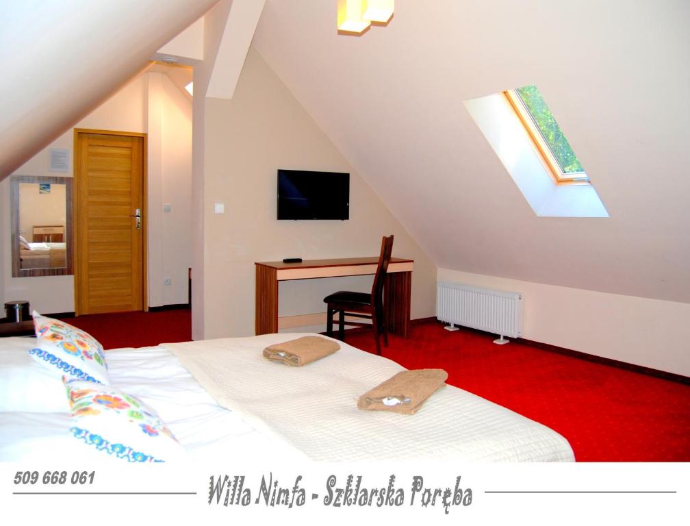 Televízia a/alebo spoločenská miestnosť v ubytovaní Willa Nimfa pokoje i apartamenty, również cała willa na wyłączność