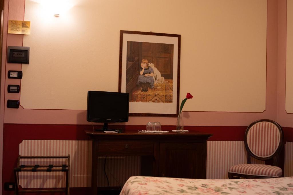 TV a/nebo společenská místnost v ubytování Arca Hotel