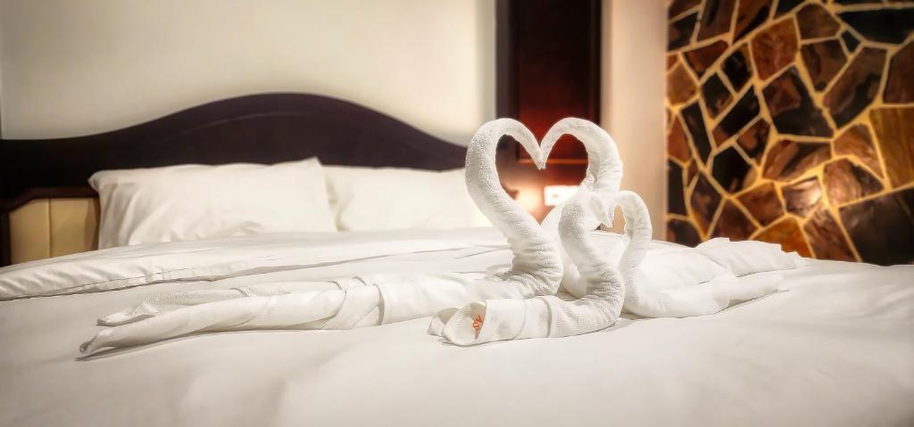 Postel nebo postele na pokoji v ubytování Arya Suites Patong Beach
