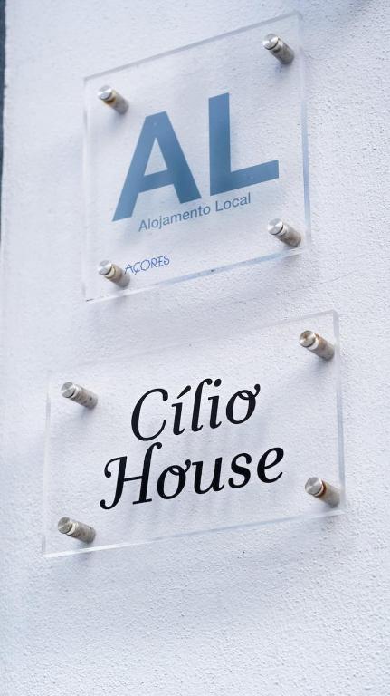 a sign for a clio house on a wall at Cilio House in Ponta Delgada
