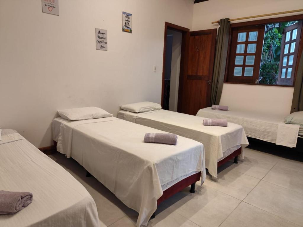 Voodi või voodid majutusasutuse CACAU HOSTEL & SUITES toas