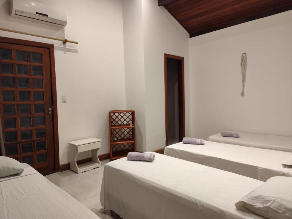 Voodi või voodid majutusasutuse CACAU HOSTEL & SUITES toas