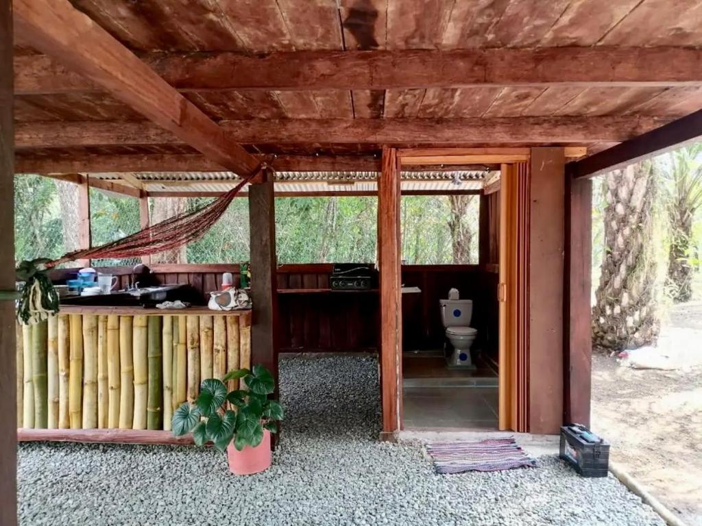 a bathroom with a toilet inside of a house at La Chonta de Corcovado in Puerto Jiménez