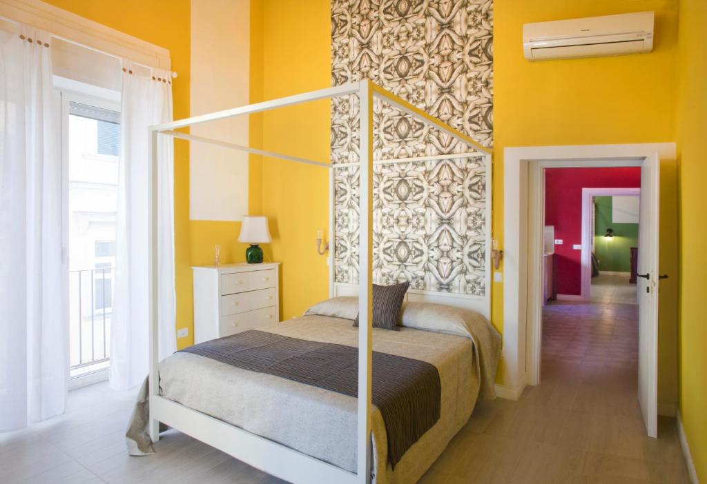 Ένα ή περισσότερα κρεβάτια σε δωμάτιο στο Au Vieux Lavinaio