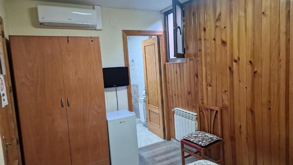 TV a/nebo společenská místnost v ubytování Hostal Escarla