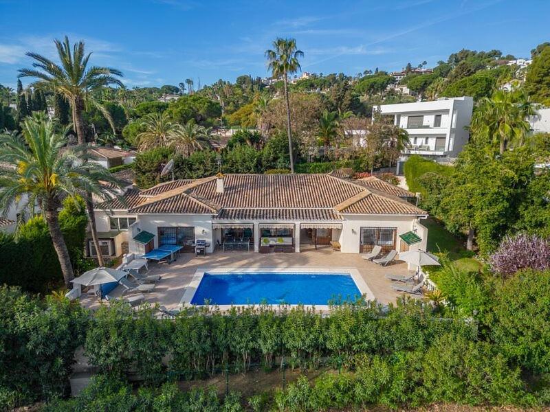an aerial view of a house with a swimming pool at Villa Casa La Concha - Luxury 6 bedroom Villa in Marbella, Beautiful Mountain View, Heated Swimming Pool, 15min walk to Puerto Banus Beaches, Sleeps up to 12 in Marbella