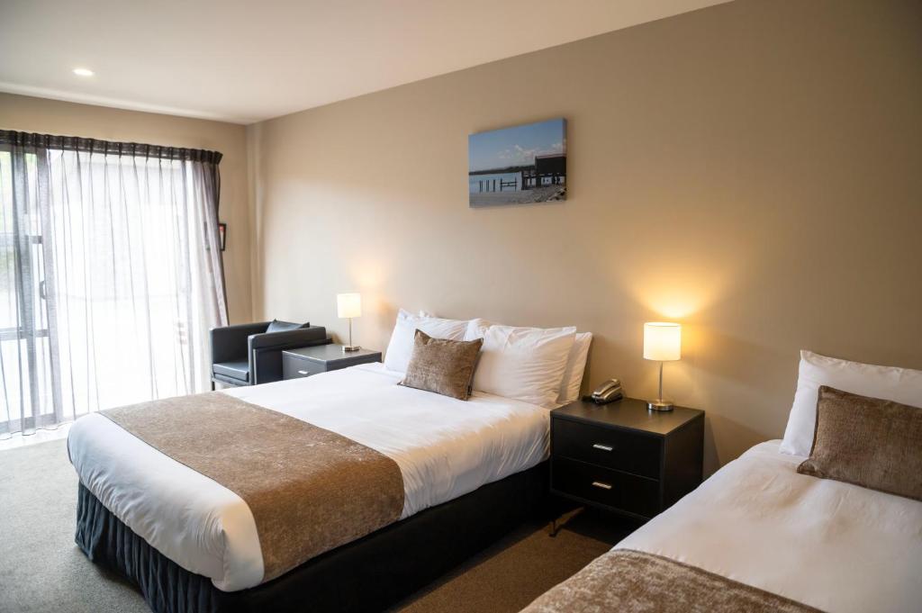 Postel nebo postele na pokoji v ubytování 58 On Cron Motel