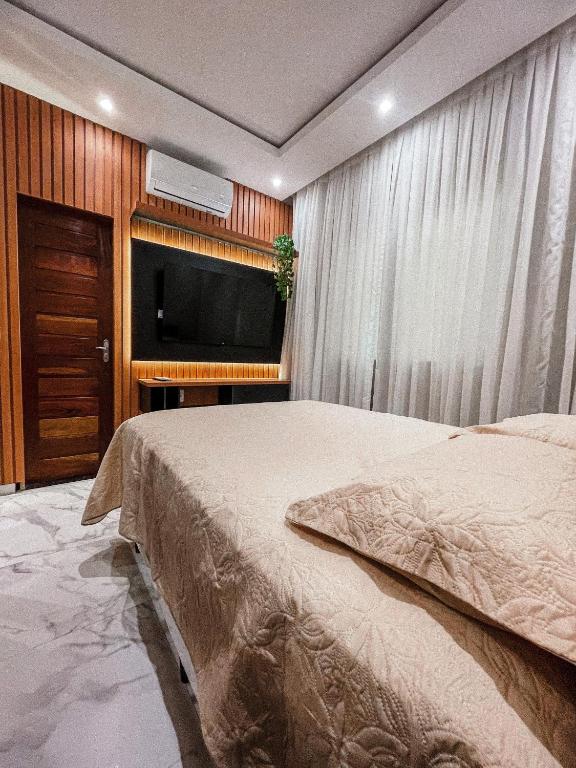 Postel nebo postele na pokoji v ubytování Life House Ubajara
