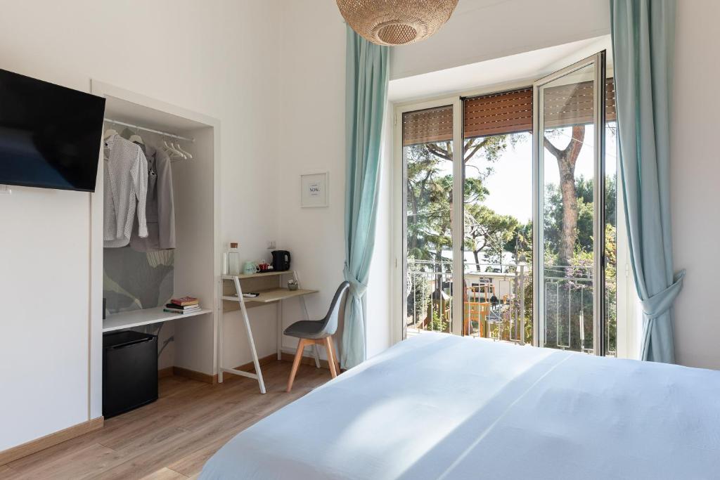 Postel nebo postele na pokoji v ubytování B&B Vitruvio Suites