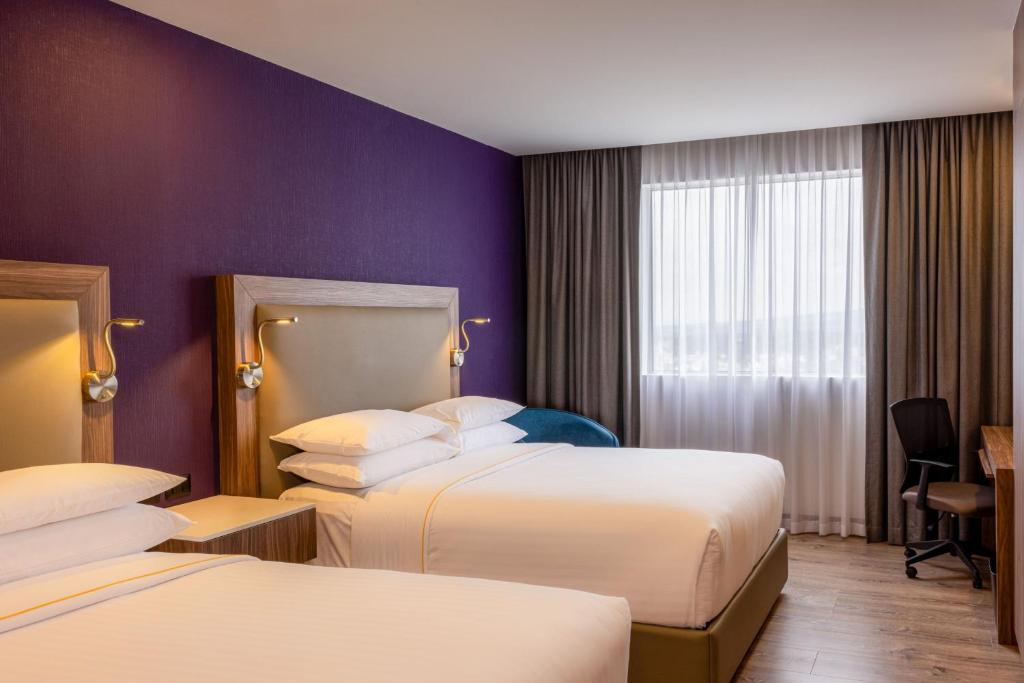 Postel nebo postele na pokoji v ubytování Sheraton Guadalajara Expo