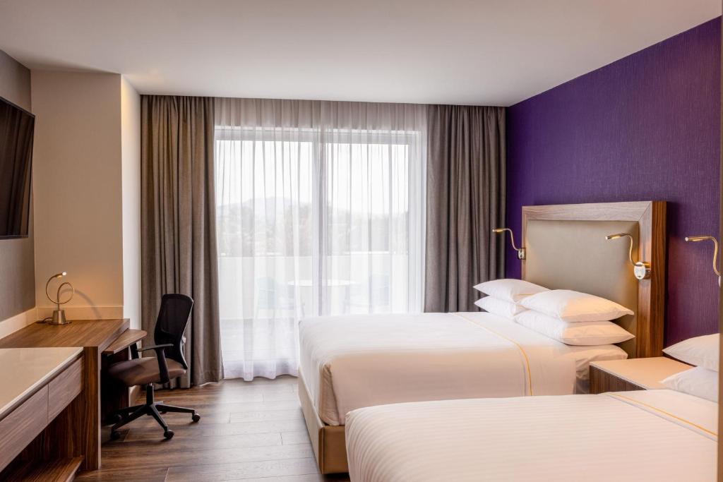 Postel nebo postele na pokoji v ubytování Sheraton Guadalajara Expo