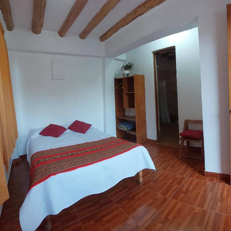 Postel nebo postele na pokoji v ubytování Hostal Miramonti