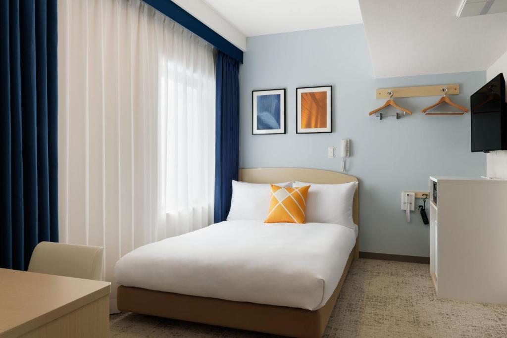 Postel nebo postele na pokoji v ubytování Four Points Flex by Sheraton Utsunomiya
