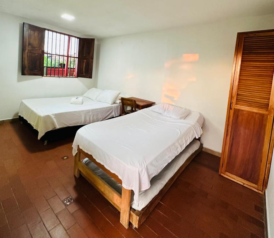 Een bed of bedden in een kamer bij Eco Lodge La Juanita