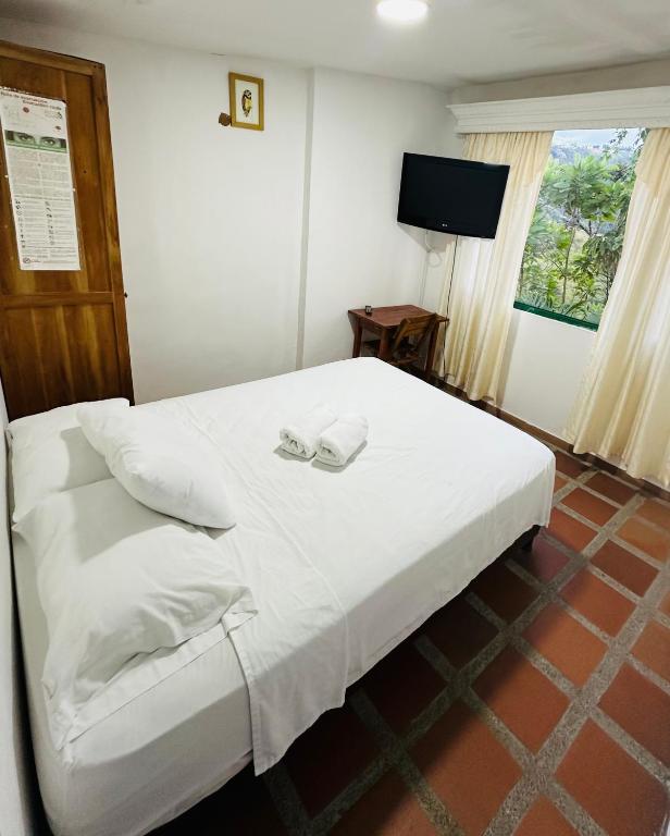 Een bed of bedden in een kamer bij Eco Lodge La Juanita