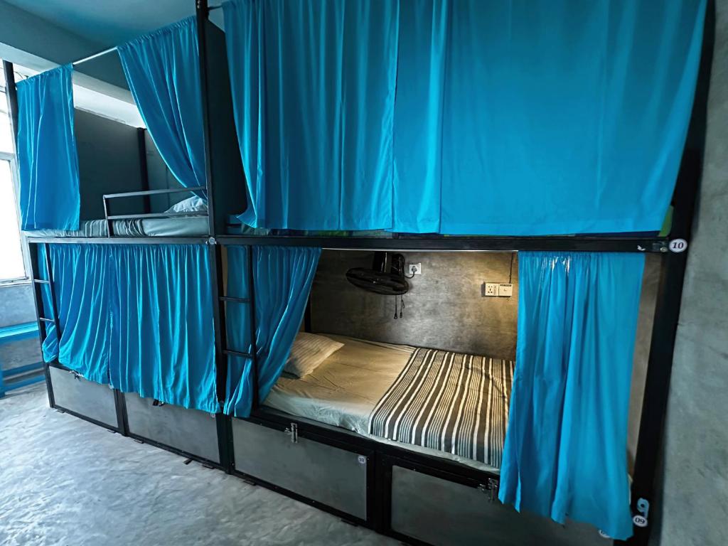Postel nebo postele na pokoji v ubytování Cycling Backpacker Hostel