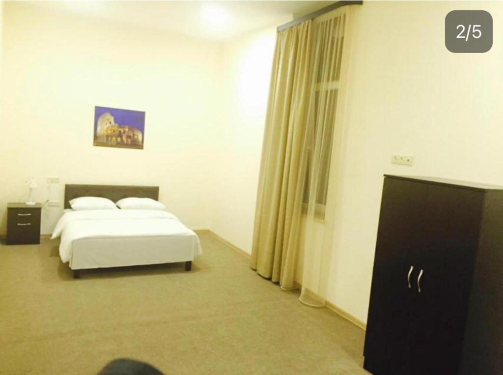 Postel nebo postele na pokoji v ubytování Home inn hotel