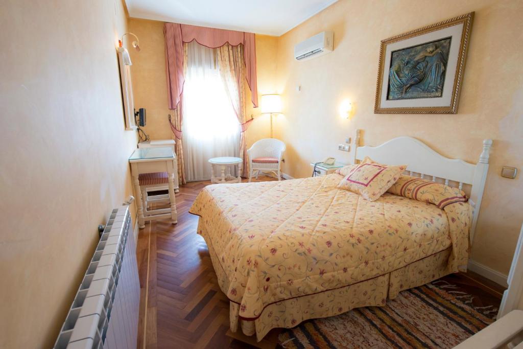 Postel nebo postele na pokoji v ubytování Los Arcos