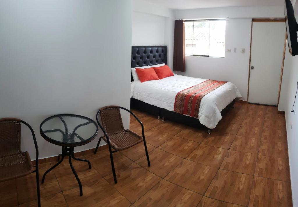 Ένα ή περισσότερα κρεβάτια σε δωμάτιο στο Cusco de mis Sueños Hostal - II