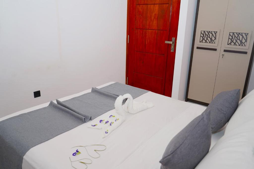 Postel nebo postele na pokoji v ubytování Pebbles villa
