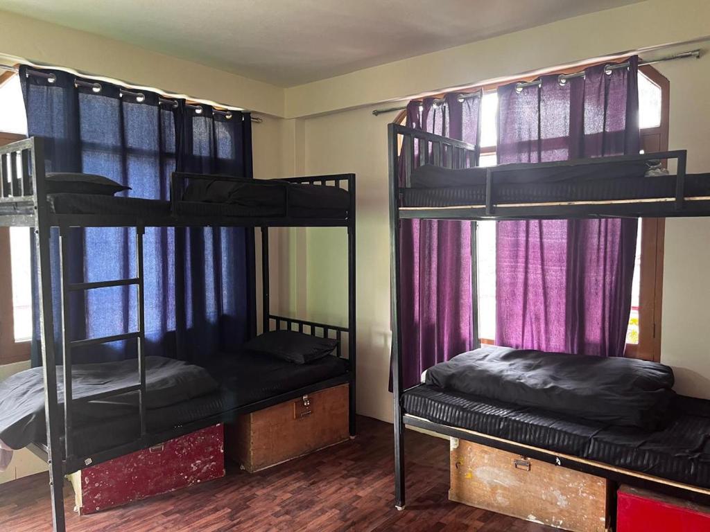 Letto o letti in una camera di Nomadic Den Manali